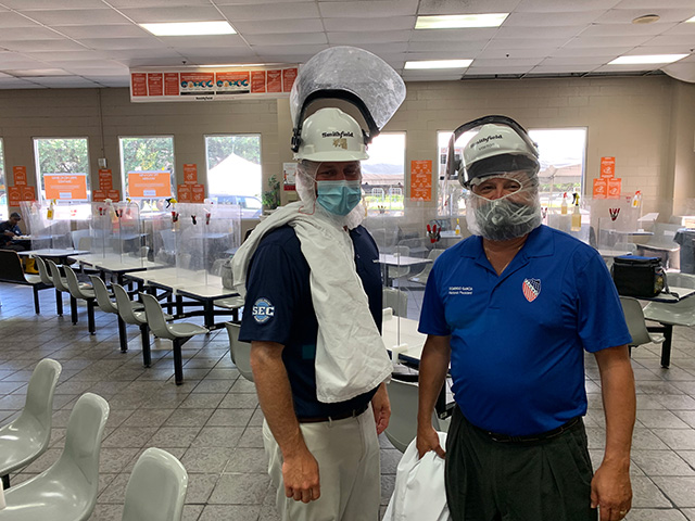 President Domingo Garcia at Smithfield Foods plant break area for employees.