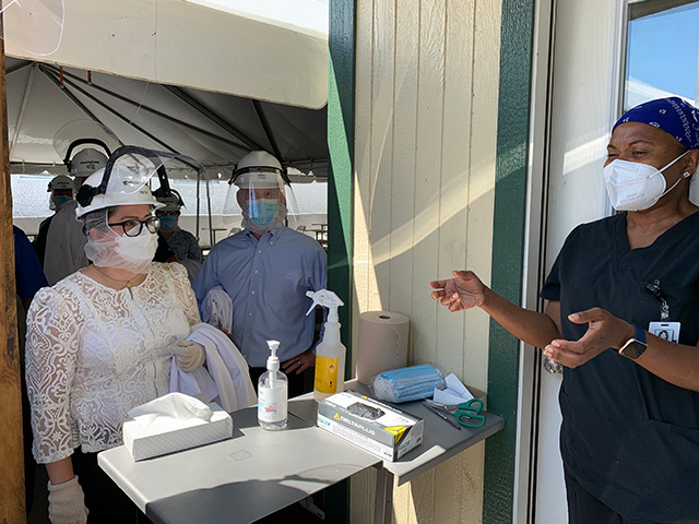 Sindy Benavides speaking with a nurse who conducts onsite COVID-19 testing for Smithfield Foods employees. 